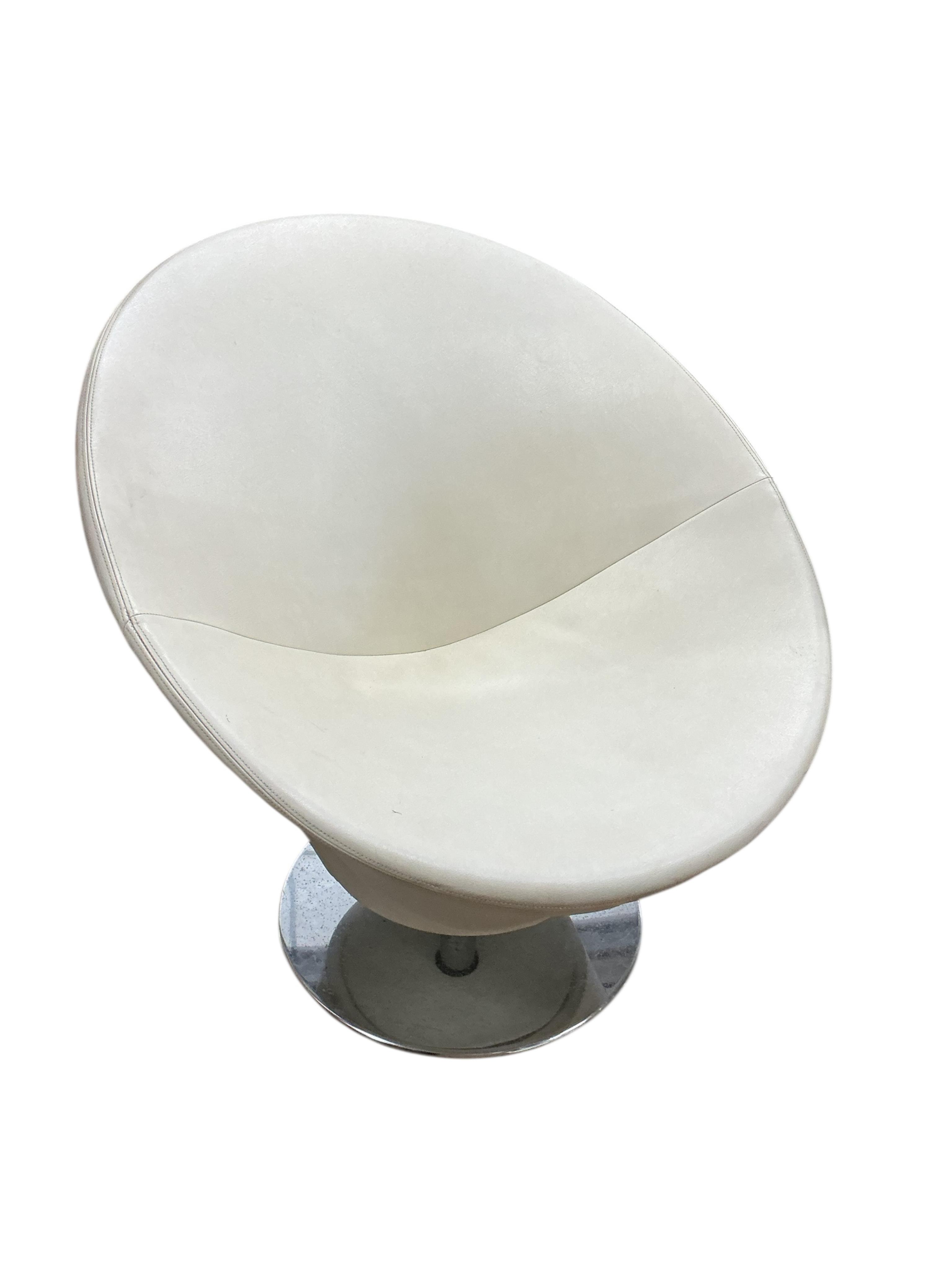 A pair of contemporary circular frame swivel lounge chairs on chrome bases, width 80cm, height 83cm